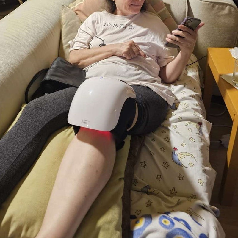 customer review sitting on the sofa and watching tv while using gladiora knee massager